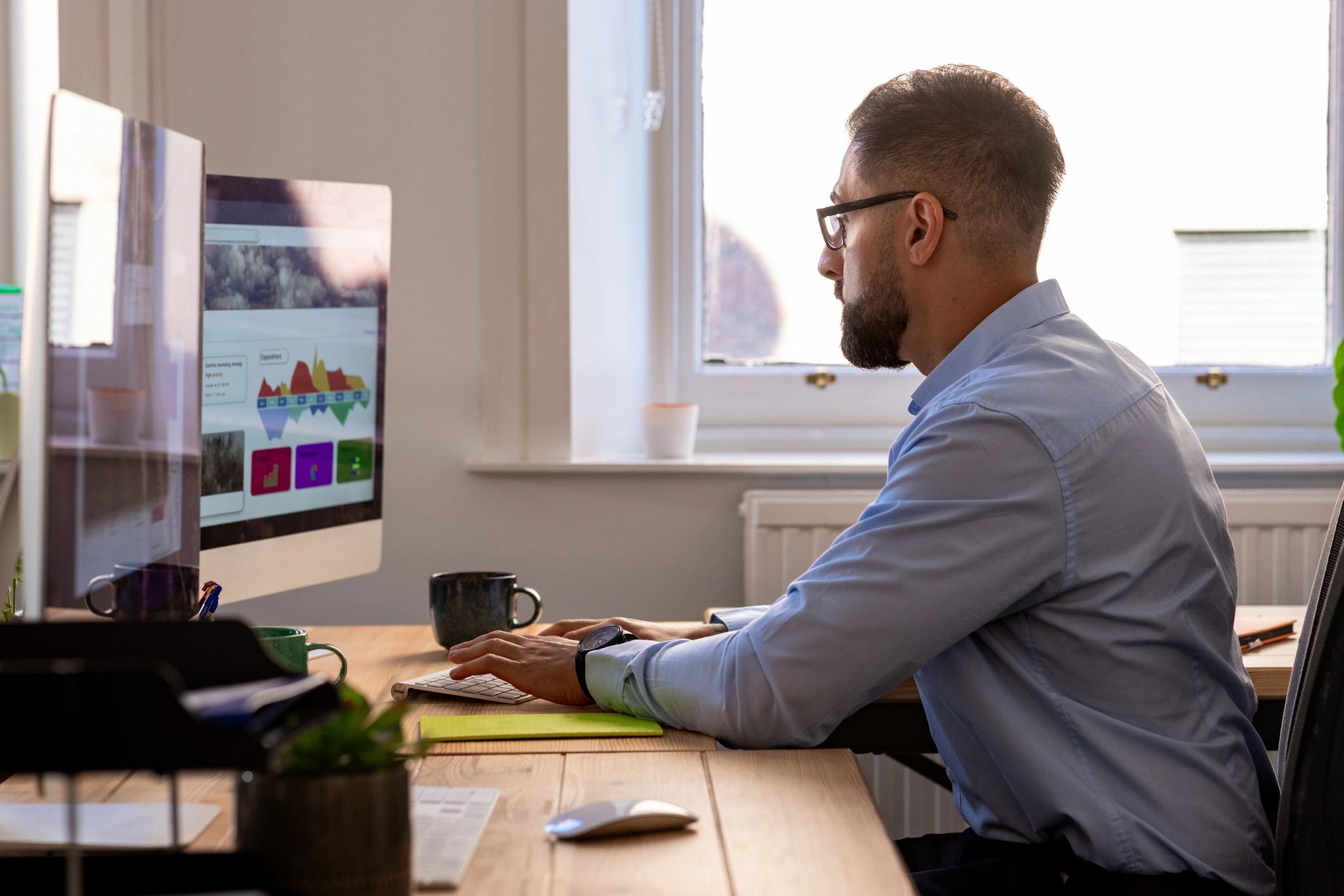 Technology professional working at advanced engineering workstation